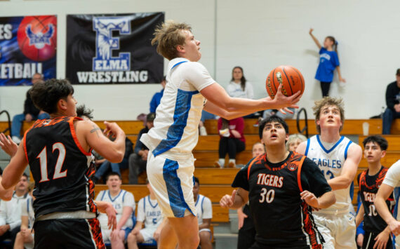 NICOLE SHANNON | MAIN FOCUS MEDIA Elma senior Isaac McGaffey scores on a drive to the basket during the a 66-56 win over Centralia on Tuesday at Elma High School.