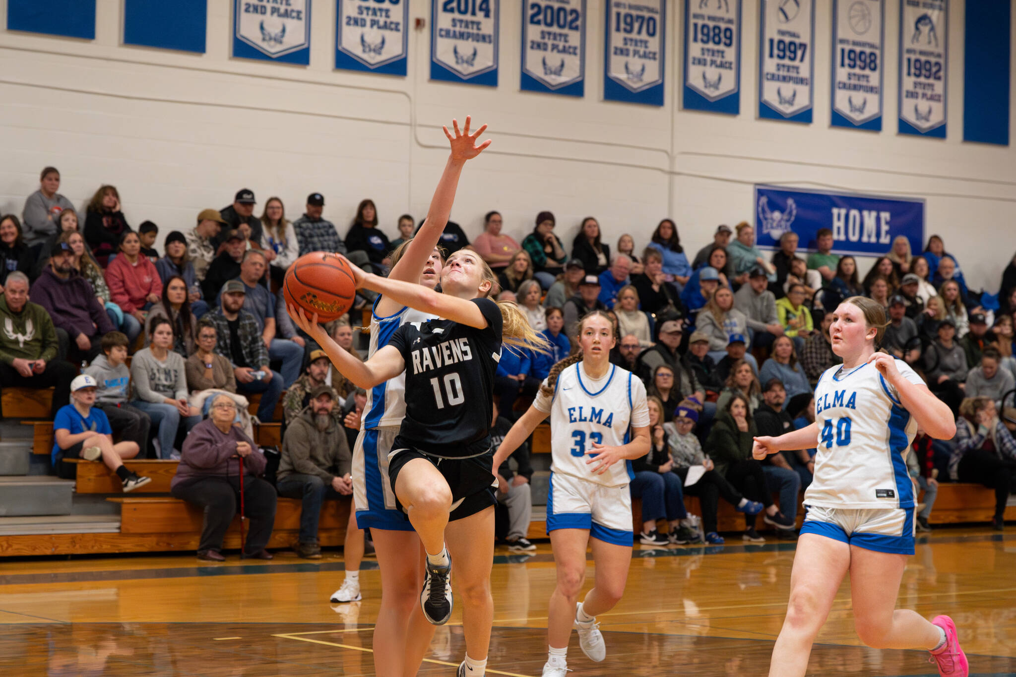 NICOLE SHANNON | MAIN FOCUS MEDIA
Raymond-South Bend's Emma Glazier (10) drives to the basket for a layup during a 57-28 win over Elma on Thursday at Elma High School.
