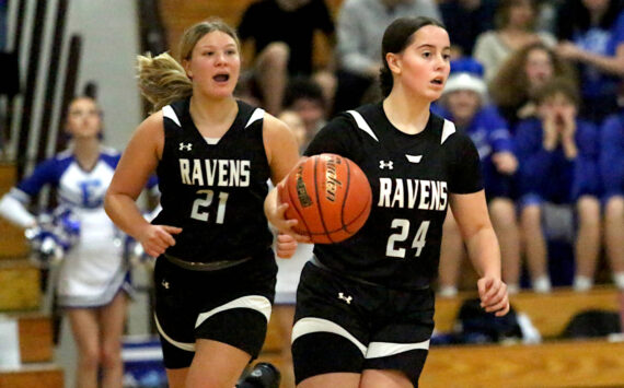 RYAN SPARKS | THE DAILY WORLD
Raymond-South Bend's Ava Stigall (24) brings the ball up the court flanked by teammate Kassie Koski during a 57-28 win over Elma on Thursday at Elma High School.
