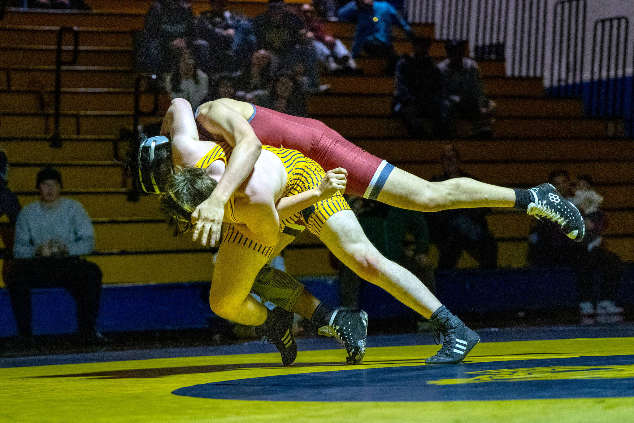 PHOTO BY FOREST WORGUM Aberdeen’s Andrew Vannoy (yellow) gets Hoquiam’s Juan Aube off his feet during a 175-pound match at a season-opening dual meet on Thursday at Aberdeen High School.