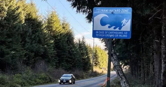 John Ryan / KUOW
A car exits a tsunami hazard zone on state Route 109 north of Moclips last January.