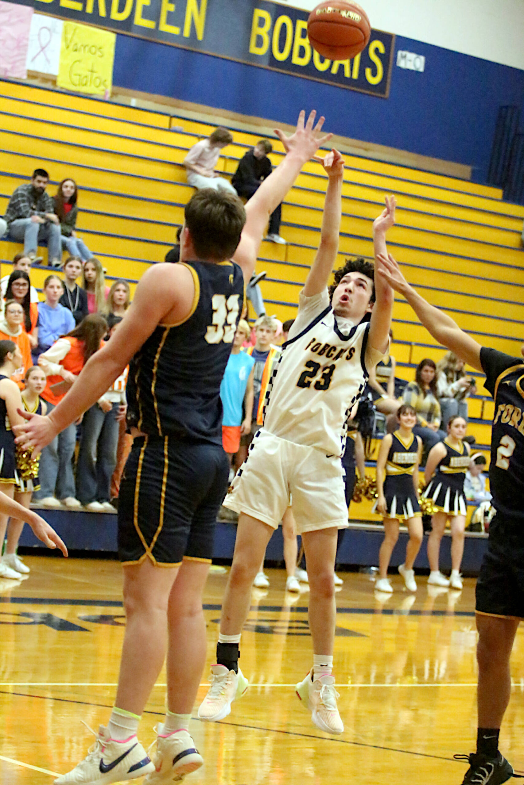 RYAN SPARKS | THE DAILY WORLD Aberdeen’s Jhacob Quezada (23) shoots over Forks’ Radly Bennett during the Bobcats’ 62-34 victory on Wednesday at Sam Benn Gymnasium in Aberdeen.