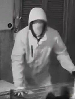 A suspect caught on video during a marijuana burglary.