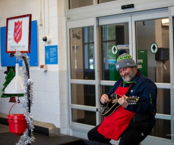 <p>4-Ever Moments Photography</p>
                                <p>Silver Steele plays guitar while outside of Safeway in Aberdeen as he raises money for the Salvation Army, his 14th year doing so.</p>