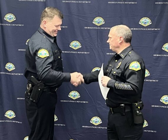 <p>APD photo</p>
                                <p>Aberdeen Police Chief Dale Green congratulates Gary Sexton on his promotion to the rank of lieutenant.</p>