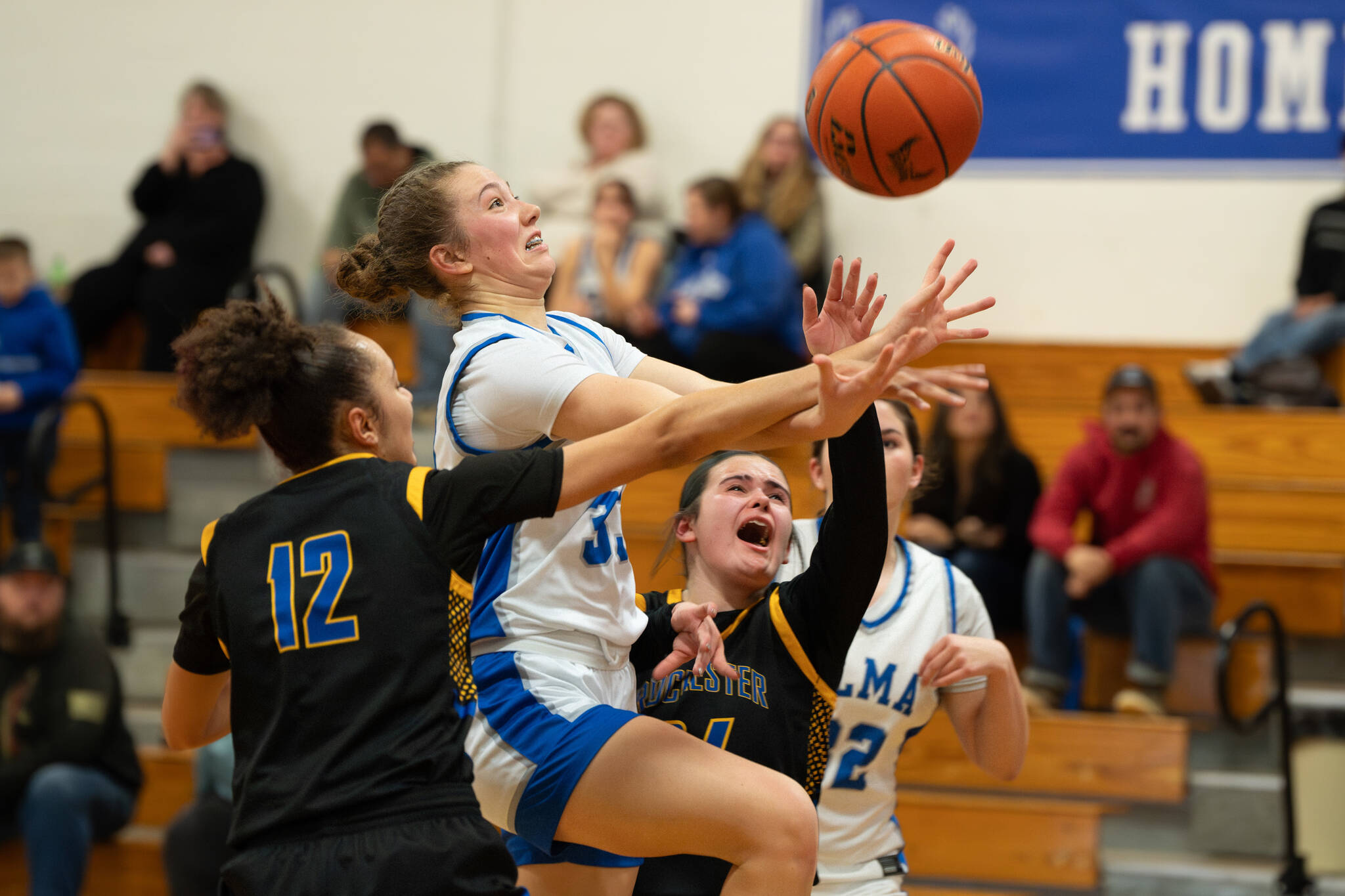 NICOLE SHANNON | MAIN FOCUS MEDIA Elmas Olivia Moore (middle) is fouled during a 63-37 victory over Rochester on Wednesday at Elma High School.