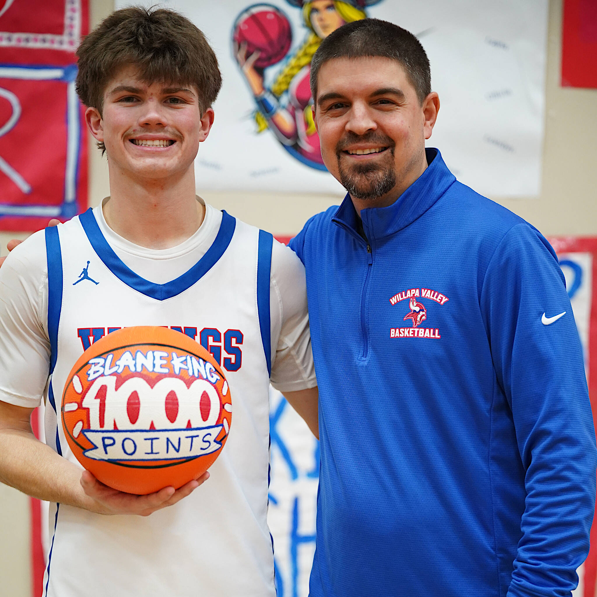 PHOTO BY BRYCE NEVA Willapa Valley senior Blane King (left) poses for a photo with head coach Derek Rask after eclipsing 1,000 points in his prep career during an 88-26 win over Mary M. Knight on Tuesday in Menlo.