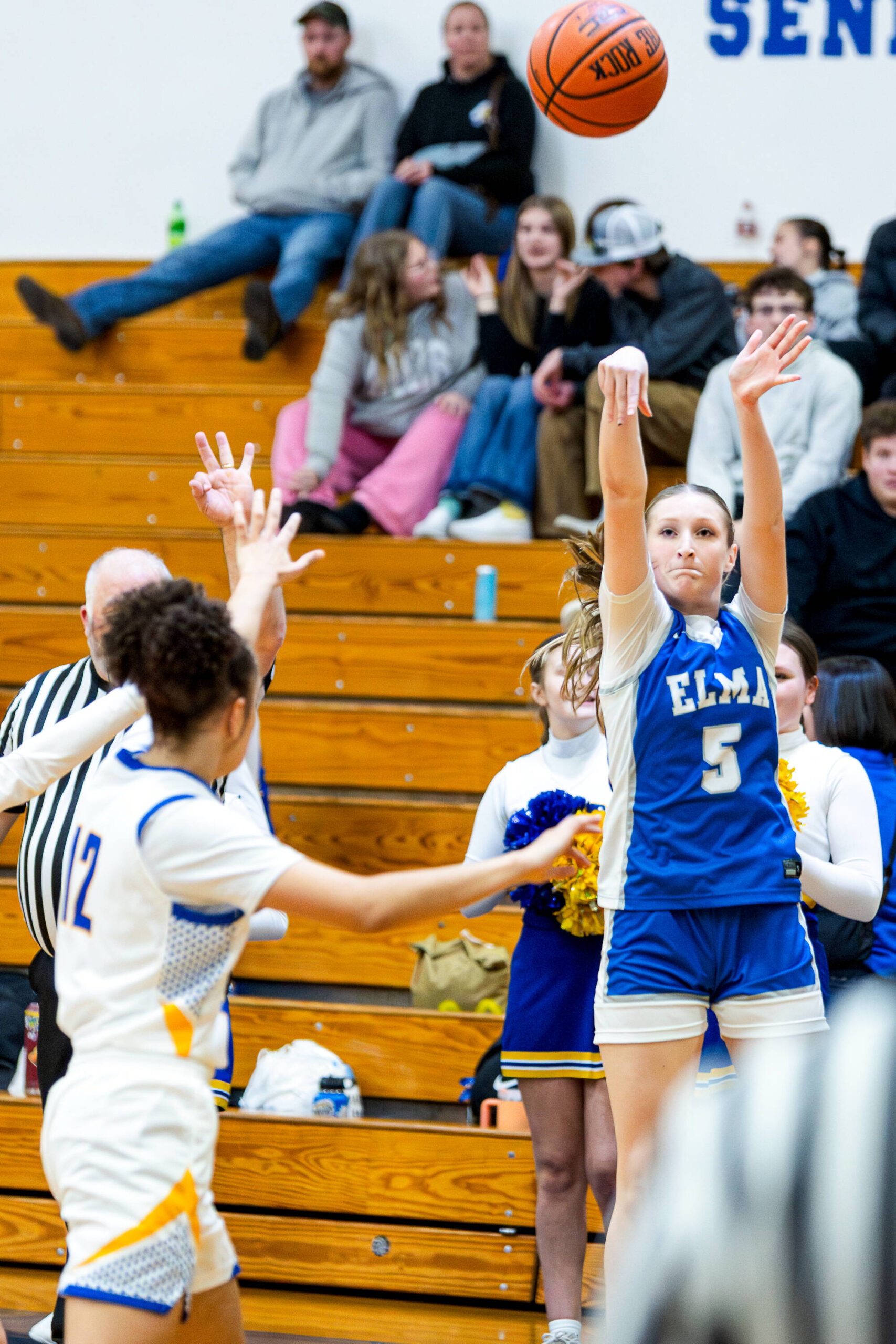 PHOTO BY MIKE ROBERTS Elma guard Mikayla Roberts (5) hits one of her five 3-pointers in a 51-30 win over Rochester on Thursday in Elma.