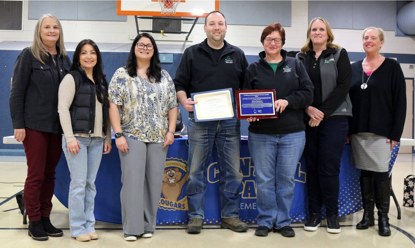 Aberdeen School District
Weyerhaeuser employees Kyle Williams and Brenda Schumacher, center, along with Aberdeen Co-Superintendent Traci Sandstrom and Directors Mardi Emard-Colburn and Jeanne Marll at left and, at right, President Jennifer Durney and Co-Superintendent Lynn Green.