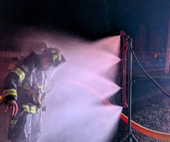 <p>East Grays Harbor Fire and Rescue</p>
                                <p>An East Grays Harbor Fire and Rescue firefighter is washed down after firefighting efforts in Elma.</p>