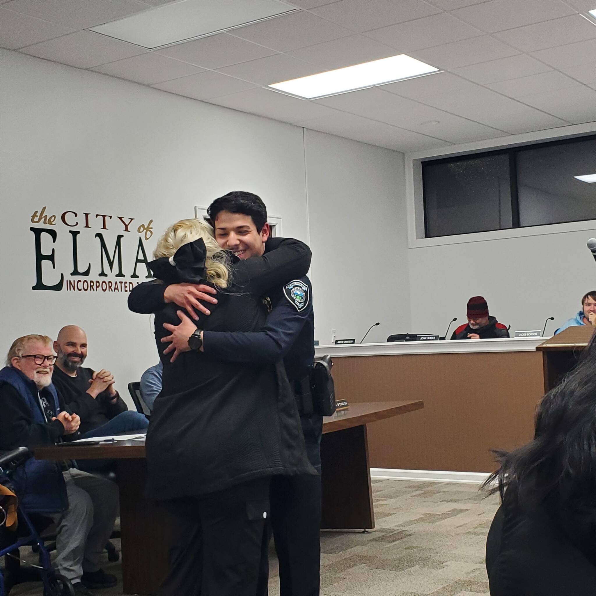 Andrea Watts / The Daily World
During the city of Elma City Council meeting on Feb. 2, Mayor Josh Collette swore in Officer Josh Rojas. Before the oath was administered, Police Chief Susan Shultz gave a brief introduction. 
In 2021, Josh volunteered as an Aberdeen Police Explorer, where he first received exposure to patrol operations and community engagement, she said, adding, Josh chose a career in law enforcement to serve as a positive example and to make meaningful difference in his community. His goal is to become a proficient officer and pursue specialized roles, such as a drug recognition expert and or a canine handler. Following the oath, his mother, Nancy Moreno, pinned him.