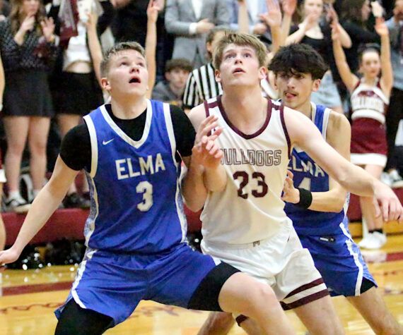 <p>RYAN SPARKS | THE DAILY WORLD Elma&rsquo;s Isaac McGaffey (3) and Montesano&rsquo;s Caden Grubb (23) compete for a rebound during the Bulldogs&rsquo; 54-32 victory on Friday at Montesano High School. With the win, Montesano earned the No. 1 playoff seed in the 1A Evergreen League.</p>