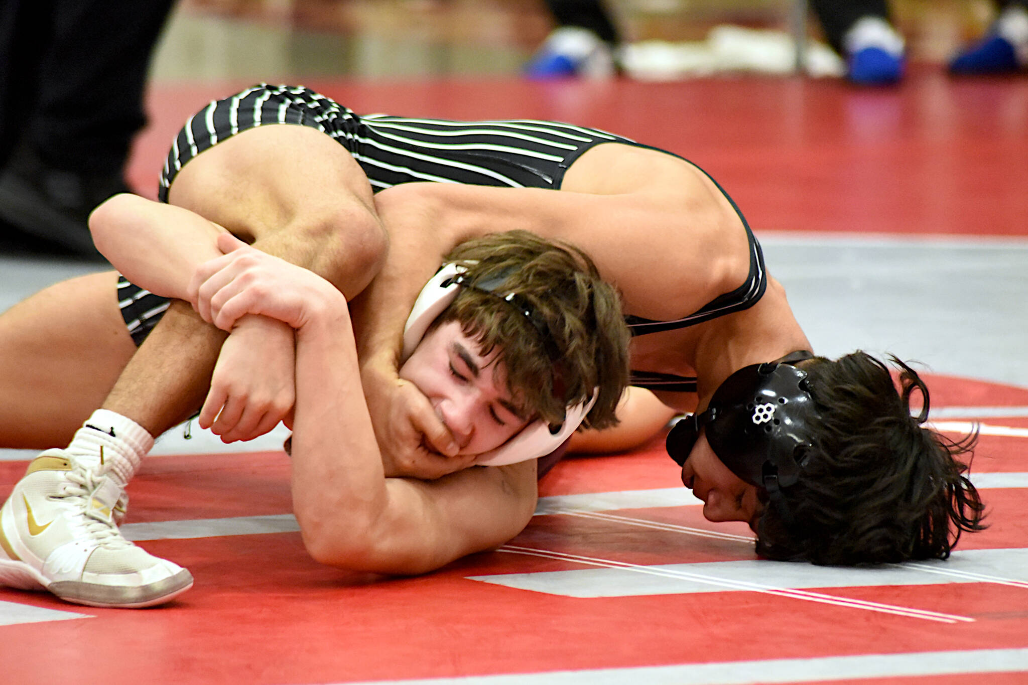 PHOTO BY SUE MICHALAK BUDSBERG Elmas Luis Torres (top) wrestles with Montesanos Titus Eaton in the 113-pound championship at the 1A Evergreen League Championship Meet on Saturday at Hoquiam High School.