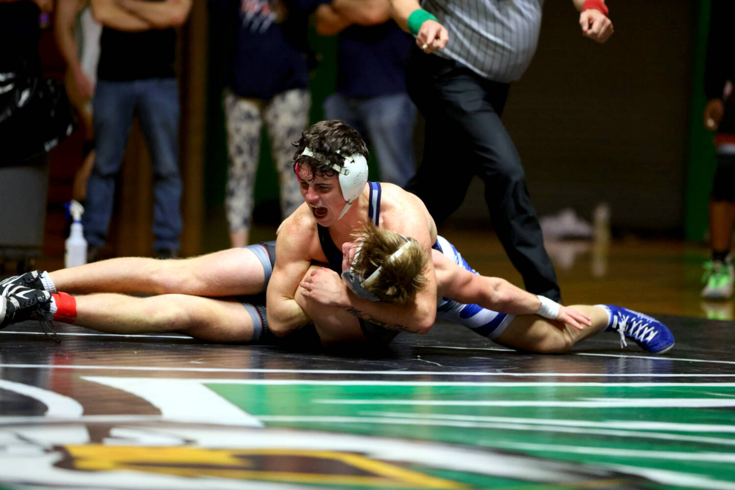 ERICA MCCRORY | MCCRORY PHOTOGRAPHY Aberdeens Glenny Black (top) controls W.F. Wests Liam Land in the 150-pound final at the 2A Evergreen Conference Championships on Saturday in Tumwater. Black won the match via 11-1 major decision.