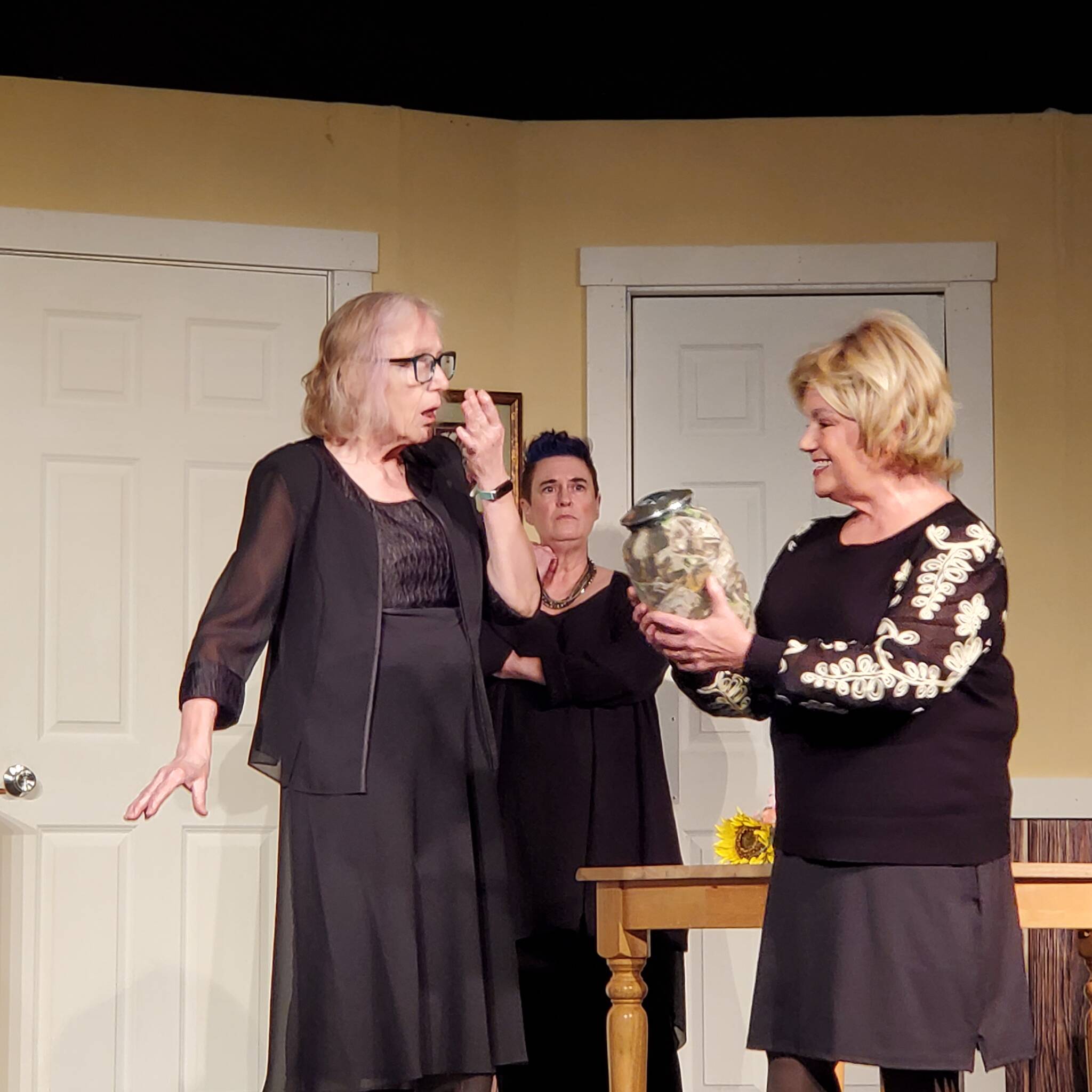 Andrea Watts / The Daily World
In the first act of Exit Laughing, the uneventful yet somber bridge night that Connie (Kaye Bramblett on the left) and Leona (Kimberly Schulz) planned for following the death of their friend Mary becomes a night of shenanigans due to Millie (Pamela Nygaard) stealing the urn with their friends ashes and bringing it to bridge night.