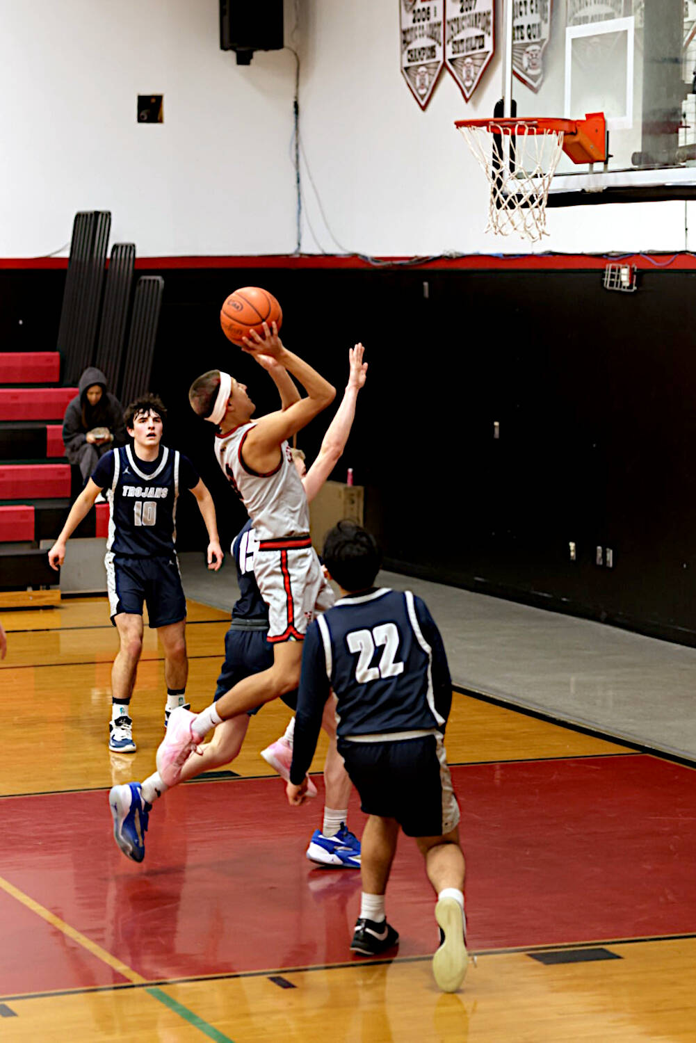 PHOTO BY TIA CHENEY Taholahs Hunter Crossguns (middle) drives to the hoop during a 60-56 victory over Pe Ell in a 1B District 4 Tournament game on Wednesday at Taholah High School.