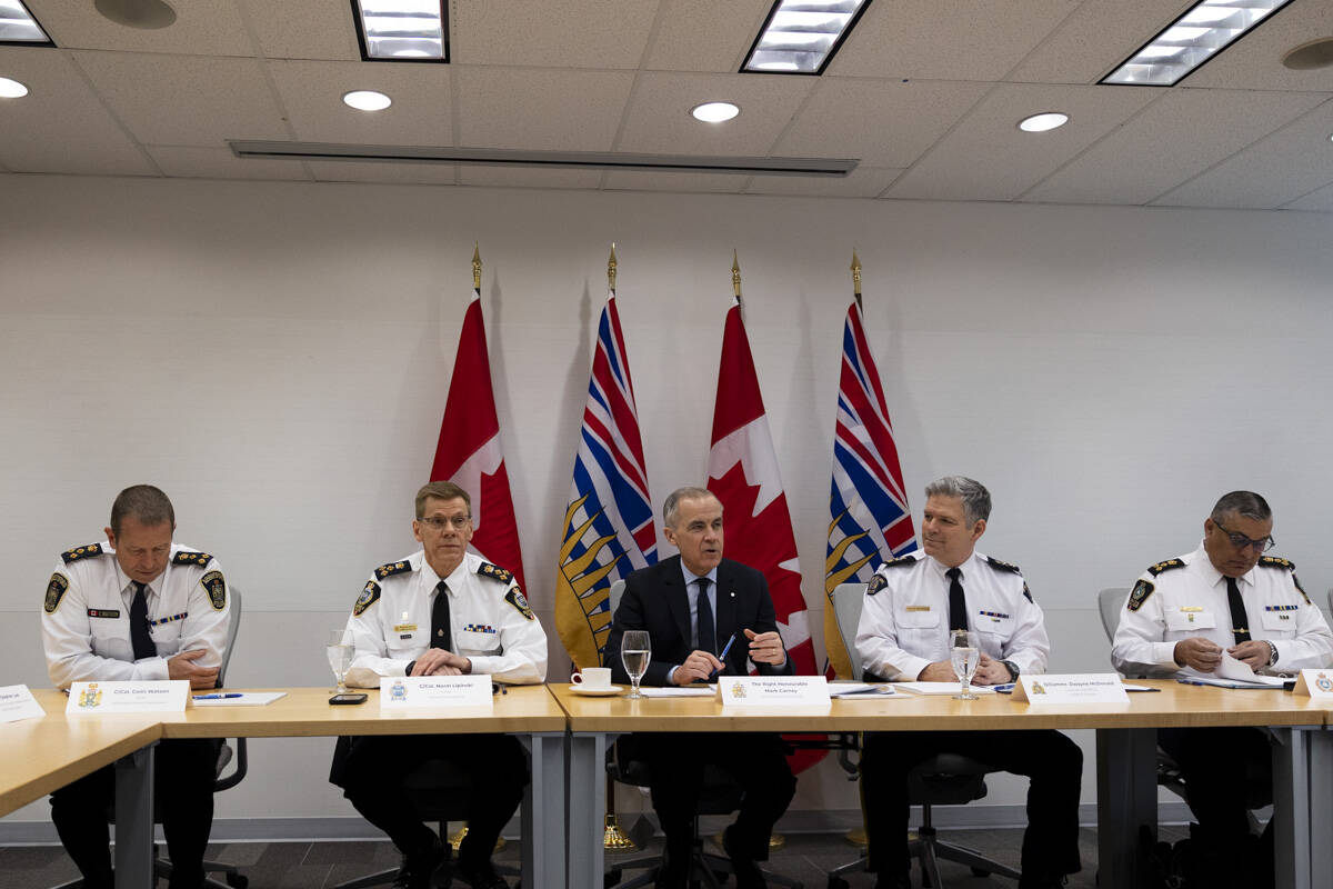Abbotsford Police Chief Colin Watson, left, Surrey Police Chief Norm Lipinski, Prime Minister Mark Carney, RCMP District commanding officer, RCMP E Division, Dwayne McDonald, and Delta Police Chief Harj Sidhu, met in Surrey on Thursday, Feb. 19, 2026. (Anna Burns/ Surrey Now-Leader)