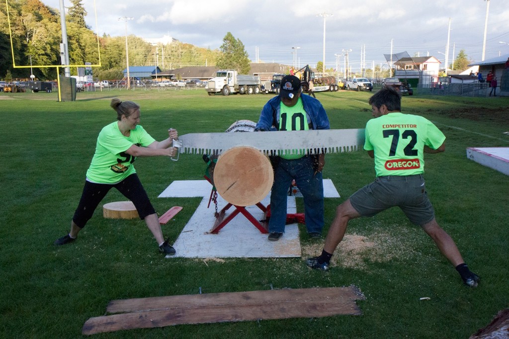 (Corey Morris | Grays Harbor Newspaper Group) Justine Bexten of Montesano works with Rob Waibel of West Linn, Ore., during the Ma and Pa bucking event at the 52nd Loggers Playday on Sept. 10 in Hoquiam.