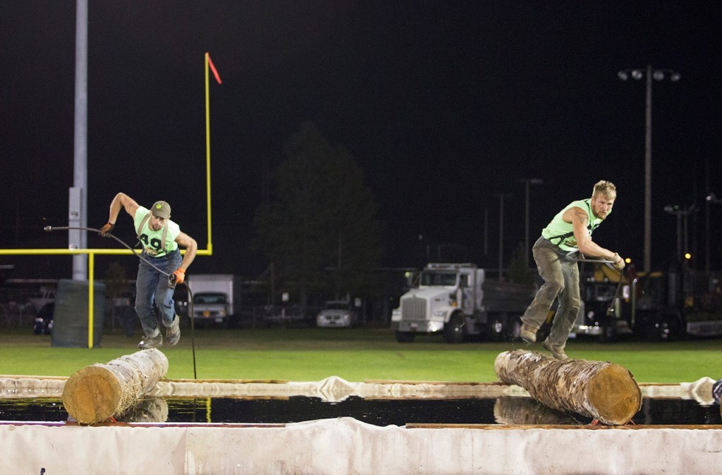 (Corey Morris | Grays Harbor Newspaper Group) Mickey Huffman and Kris Cain compete run the logs during the local choker setting event at the 52nd Loggers Playday on Sept. 10 in Hoquiam.