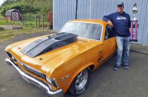 Paul Johnson proudly shows off his winning ride and great big &lsquo;Race for the Cure&rsquo; hot pink trophy.