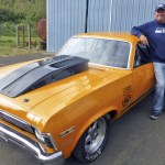 Paul Johnson proudly shows off his winning ride and great big &lsquo;Race for the Cure&rsquo; hot pink trophy.