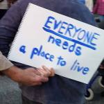 Terri Harber/Daily World A sign held toward the street outside of Aberdeen City Hall on Wednesday night. About 40 people held a candle light vigil to remember Brooke Sandback and remind the community about the plight of the local homeless population.