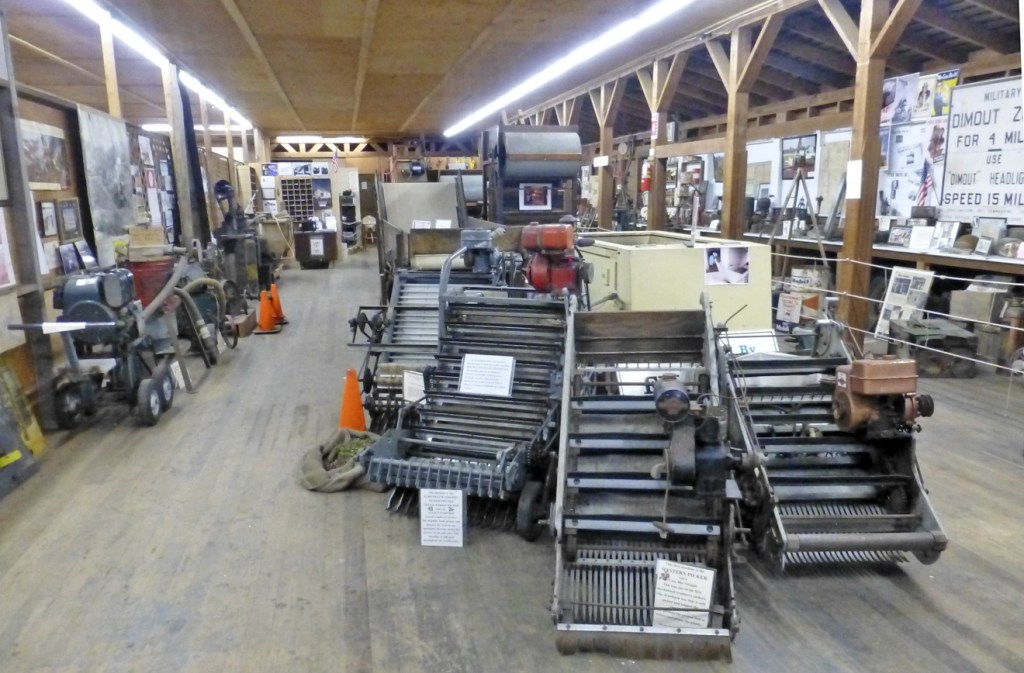The Furford Picker/Pruner, displayed next to the Western Picker it improved upon, is the showpiece of the Furford Cranberry Museum in Grayland. BARB AUE | SOUTH BEACH BULLETIN