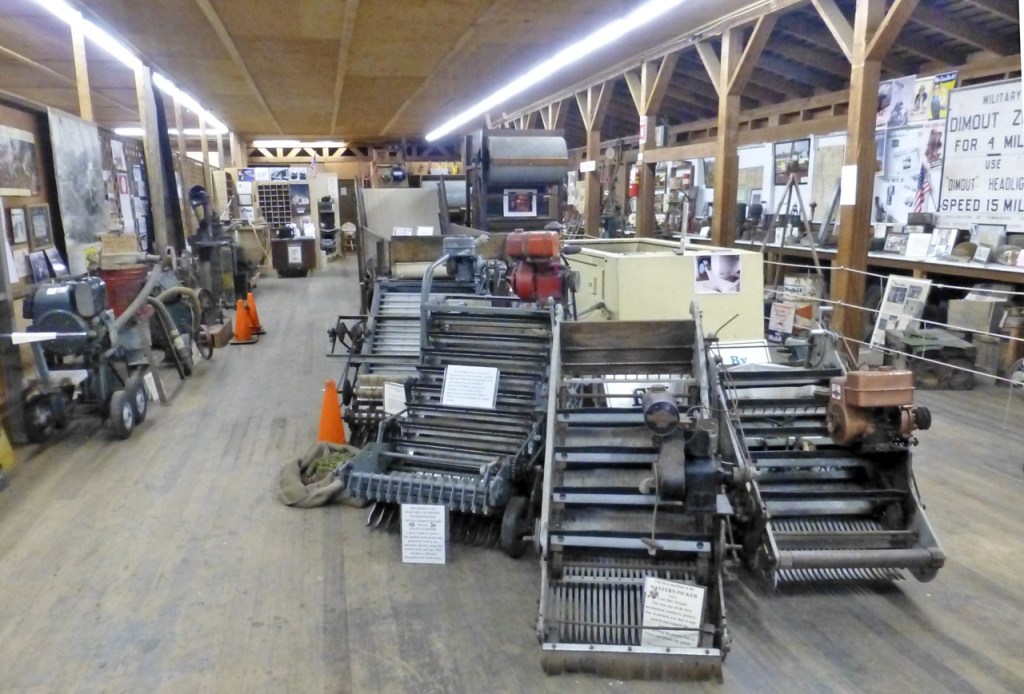 The Furford Picker/Pruner, displayed next to the Western Picker it improved upon, is the showpiece of the Furford Cranberry Museum in Grayland. BARB AUE | SOUTH BEACH BULLETIN