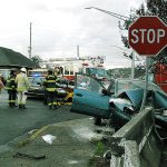 Police, Fire and EMS personnel respond to an accident at the intersection of Park and State streets early Friday evening. Three people were in the vehicle that T-boned a barrier at the stop sign. Two were transported to Grays Harbor Community Hospital for treatment. The extent of their injuries were unknown at time of press. (BOB KIRKPATRICK|THE DAILY WORLD)