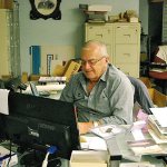 Dann Sears, who was named the 2016 Harborite of the Year, gets busy in the newly named Margret Cross Murdach Historical Photo and Document Archives lab at the Aberdeen Museum of History. BOB KIRKPATRICK|THE DAILY WORLD