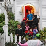 A group of trick-or-treaters brave light showers on Halloween evening at a home near the intersection of Second and L streets in Aberdeen Monday night. Halloween brought a bit more rain to the Harbor in what was already a record-setting month for rainfall in the region. (Bob Kirkpatrick | The Daily World)