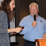 Angelo Bruscas/North Coast News: Lisa Smith presents the New Business of the Year award to Extreme Fun Center owner John Schweiger.