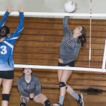 (Brendan Carl | The Daily World) Montesano&rsquo;s Josie Talley slams the ball past an Elma defender during an Evergreen 1A League match at Elma on Thursday. The Bulldogs defeated the Eagles 25-13, 25-17, 25-12.