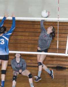 (Brendan Carl | The Daily World) Montesano&rsquo;s Josie Talley slams the ball past an Elma defender during an Evergreen 1A League match at Elma on Thursday. The Bulldogs defeated the Eagles 25-13, 25-17, 25-12.
