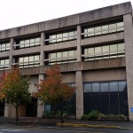This office building at 101 E. Market St., in downtown Aberdeen is called the Seafirst building. An increasing number of homeless people have been congregating in its covered parking lot and nearby. (Terri Harber|The Daily World)