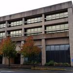 This office building at 101 E. Market St., in downtown Aberdeen is called the Seafirst building. An increasing number of homeless people have been congregating in its covered parking lot and nearby. (Terri Harber|The Daily World)
