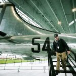Volunteer Dale Thompson, of Seattle, walks down stairs from the rear of the restored T-Square 54 Boeing B-29 airplane on Thursday. The airplane went on public display in the Museum of Flight Aviation Pavilion in Seattle in April. (Ian Terry / The Herald)