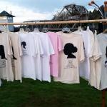 (Terri Harber/The Daily World) T-shirts hang with identities of domestic violence victims hang in Aberdeen&rsquo;s Zelasco Park on Wednesday. It was the site of the 4th Annual Domestic Violence Candle Light Vigil.