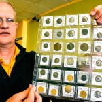 Blaine Shiff holds a group of ancient coins, some of which date back to 400 B.C., at his shop in Dormont. The Federal Trade Commission has issued final rules regarding copies of collectors items. (Darrell Sapp/Pittsburgh Post-Gazette)