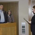 (Corey Morris | The Vidette) Ken Albert of Montesano is sworn in as county treasurer on Nov. 7 with his wife, Donna, by his side. County Prosecutor Katie Svoboda led Albert in his oath of office.