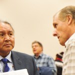 At the Chehalis Basis Strategy public hearing, held Oct. 27, in Montesano, Rodney Youckton, left, a proponent of Alternative 4 and fish habitat restoration, speaks with Al Zepp, a proponent of Alternative 1, and construction of a dam. (Stephanie Morton | The Vidette)