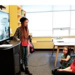 Maddy Shortt responds to a student at Cosmopolis School on Thursday who asked a question during her presentation about India. A volunteer teacher there who is set to return soon, she hopes these Cosi students also obtain some valuable lessons about life. (Terri Harber|The Daily World)