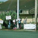 A handful of community members waived signs of support at the intersection of Sumner Avenue and Oak Street Tuesday for outgoing pediatrician Dr. Sean White and Grays Harbor Community Hospital members involved in contract negotiations. (BOB KIRKPATRICK|THE DAILY WORLD)