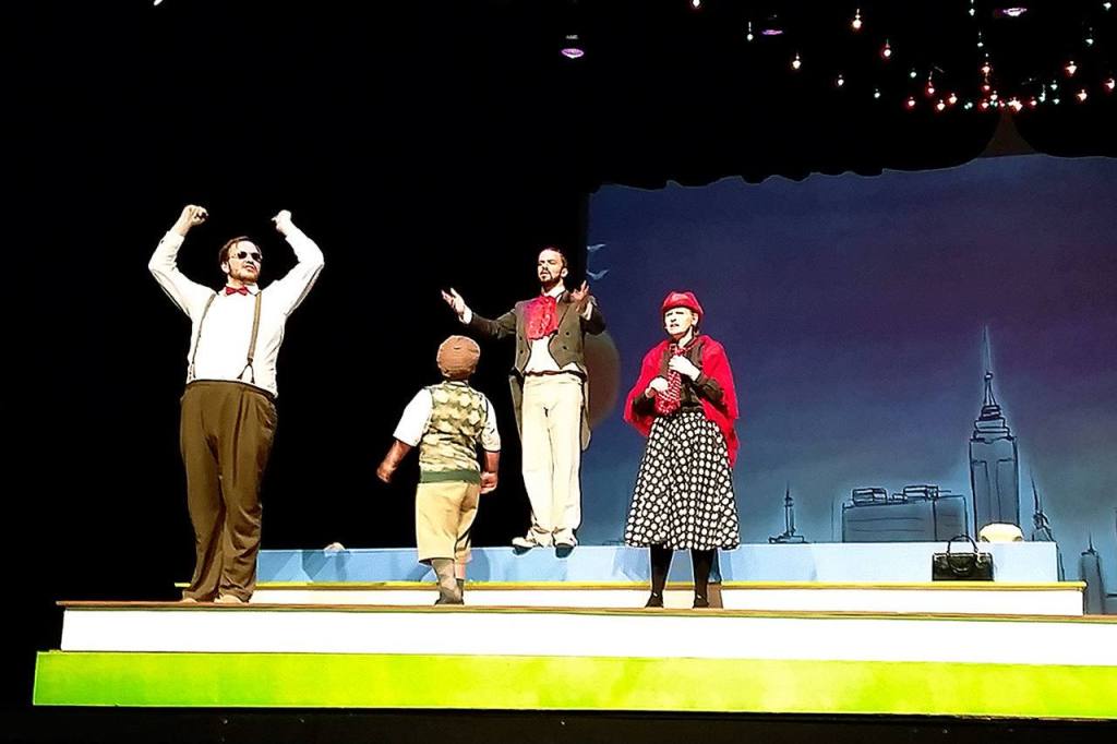 Sam Dorsch, center, turns to look at Jerrod Phelps as Adam Cooper and Sarah Hadley during rehearsal of a musical number in &ldquo;James and the Giant Peach&rdquo; on Monday evening. (Terri Harber/The Daily World)