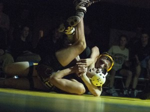 Aberdeen&rsquo;s Bodie Wharton works to pin Hoquiam&rsquo;s Andres Vasques during the Bobcats match with the Grizzlies on Wednesday. Aberdeen defeated Hoquiam 43-30. (Brendan Carl | The Daily World)