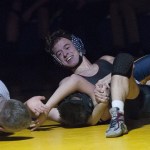 Hoquiam&rsquo;s Lutra Felton smiles as he settles in for a pin against Aberdeen&rsquo;s Cameron Harris on Wednesday. (Brendan Carl | The Daily World)