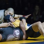 Aberdeen&rsquo;s Alex Wilson works to pin Hoquiam&rsquo;s Eva Ortiz on Wednesday. (Brendan Carl | The Daily World)