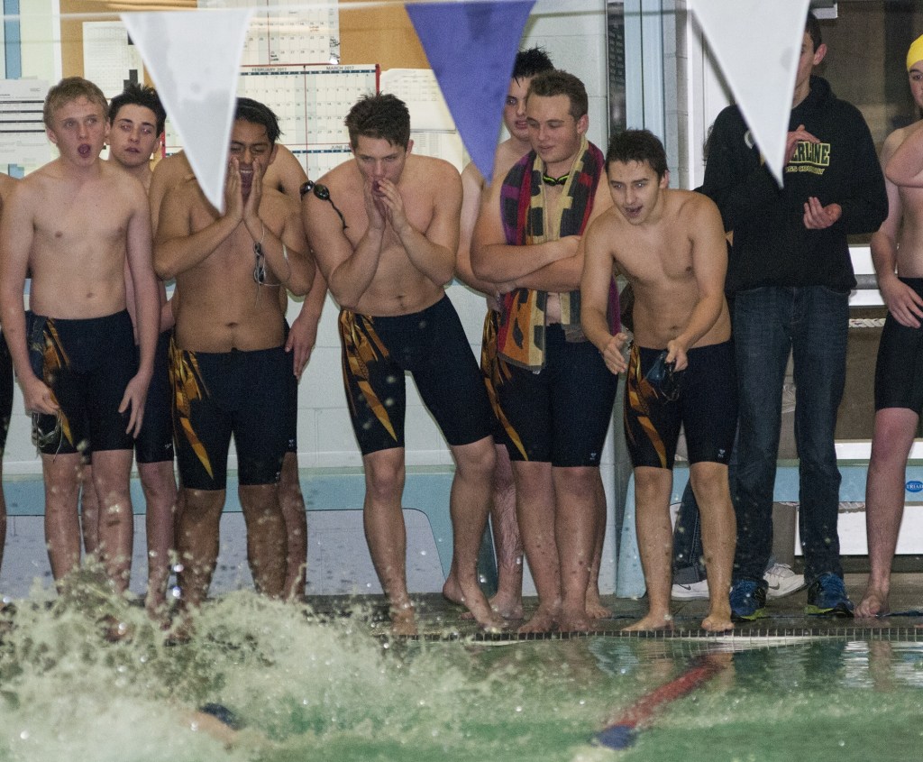 (Brendan Carl | The Daily World) Teammates cheer on Aberdeen&rsquo;s Zachary Carpenter as he swims the 800 freestyle during the Aberdeen Relays on Wednesday.