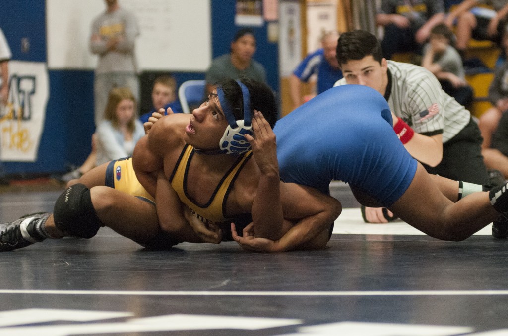(Brendan Carl | The Daily World) Aberdeen&rsquo;s Edgar Salazar takes a peek at the clock during the 120-pound final against North Mason&rsquo;s Miguel Gaspar-Hernandez on Saturday.