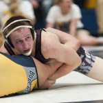 (Brendan Carl | The Daily World) Montesano&rsquo;s Jacob Ellefson tries to pin Aberdeen junior Tyler Souphommanichanh during the 132-pound final on Saturday.